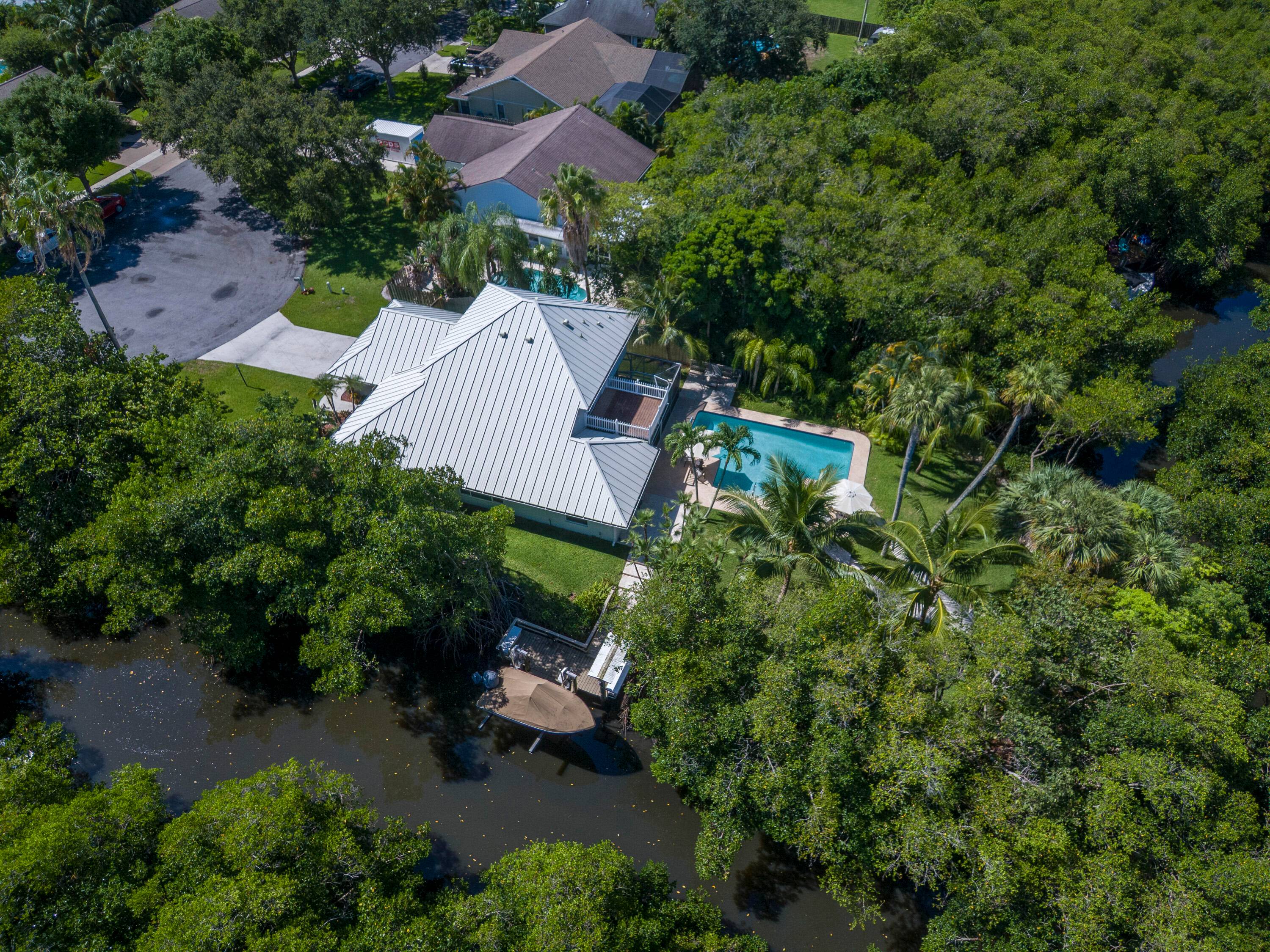 Updated CBS home on a private corner lot with 280' of waterfront on scenic Jones Creek.