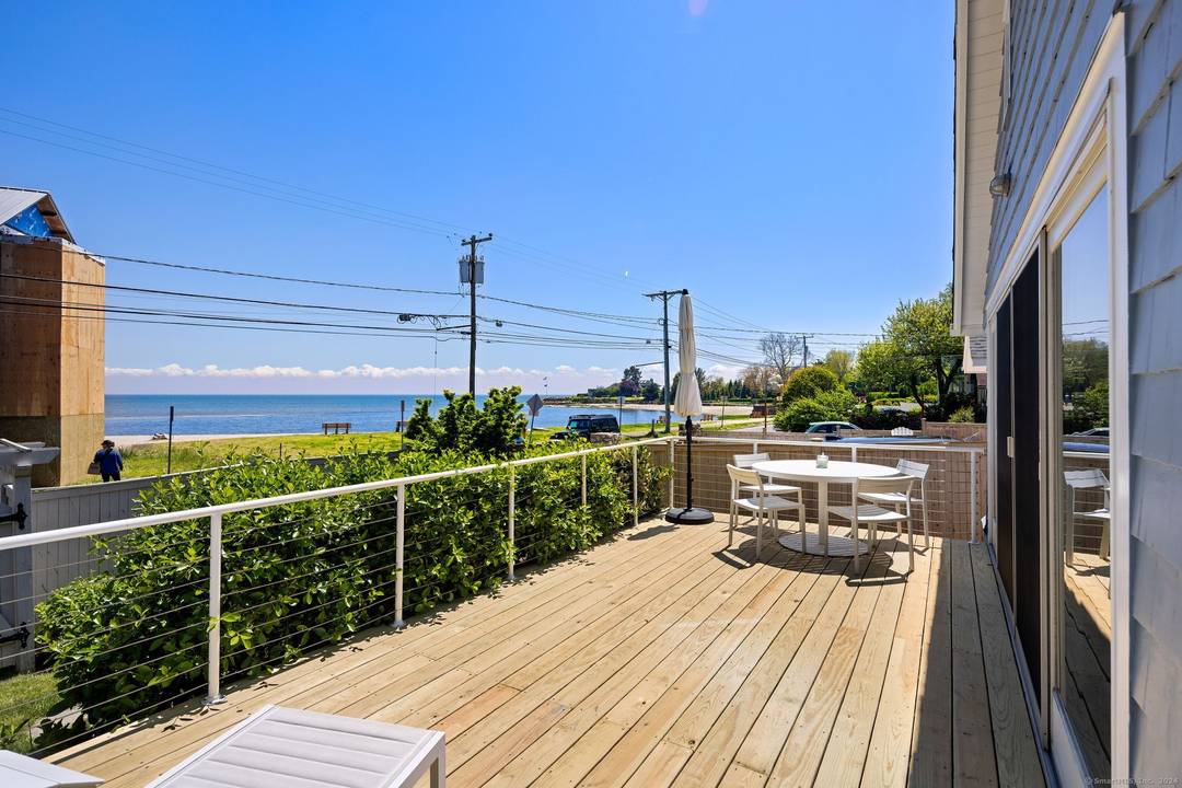 Light filled Contemporary Ranch offering breathtaking water views of the LI Sound.