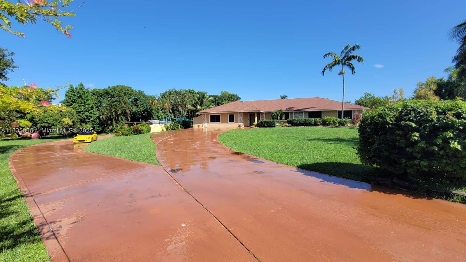 Beautiful Ranch Style 5 bedrooms 4 bathrooms with office and game room home on an acre in well sought after Southwest Ranches Ivanhoe Estates Community.