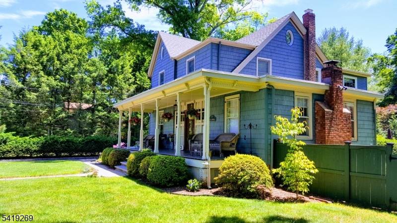 Welcome to this Four bedroom, three full bath Colonial featuring a charming lemonade porch.