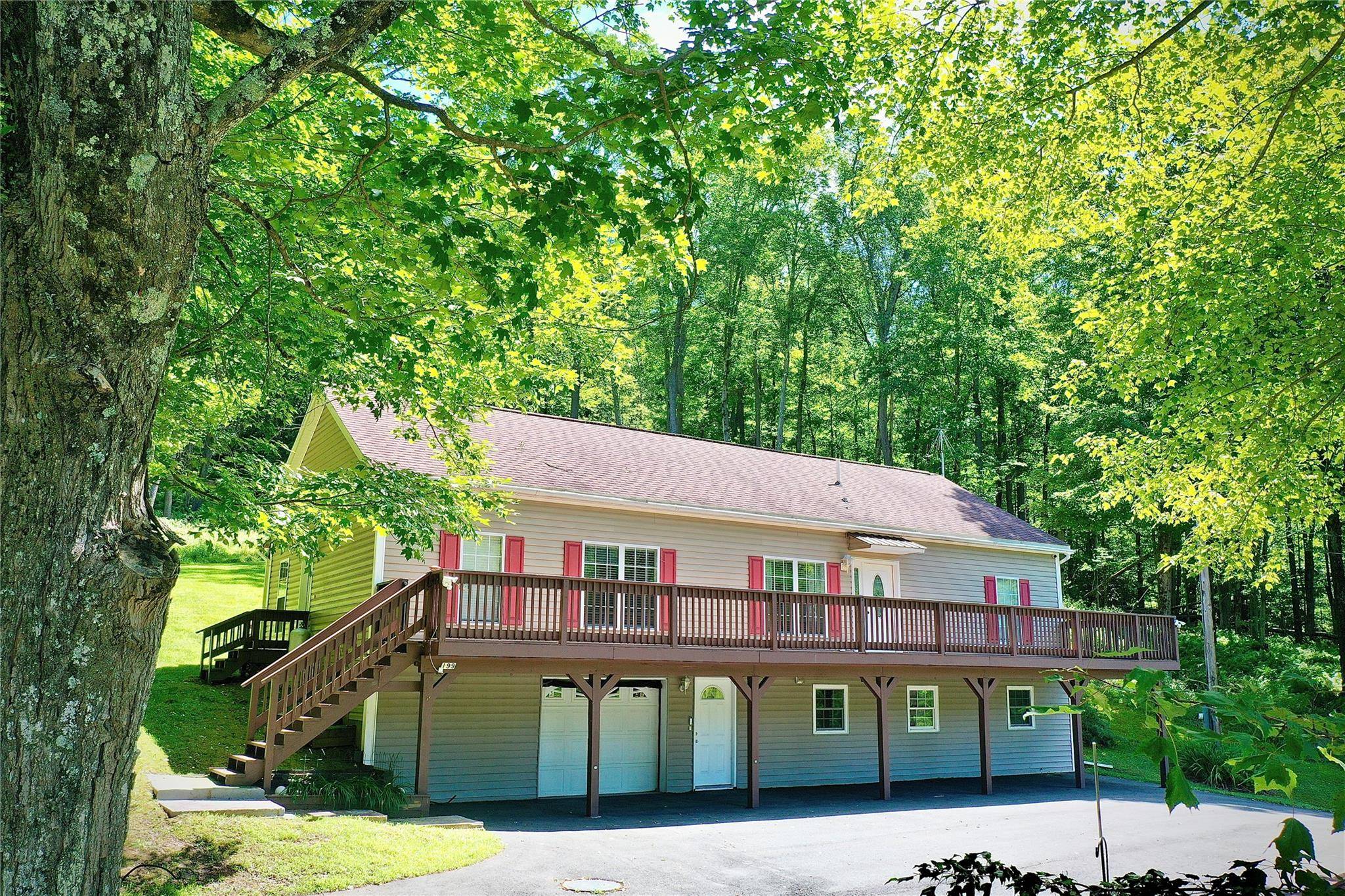 Looking for a beautifully maintained, open floor plan, contemporary home with a huge deck and a view ?