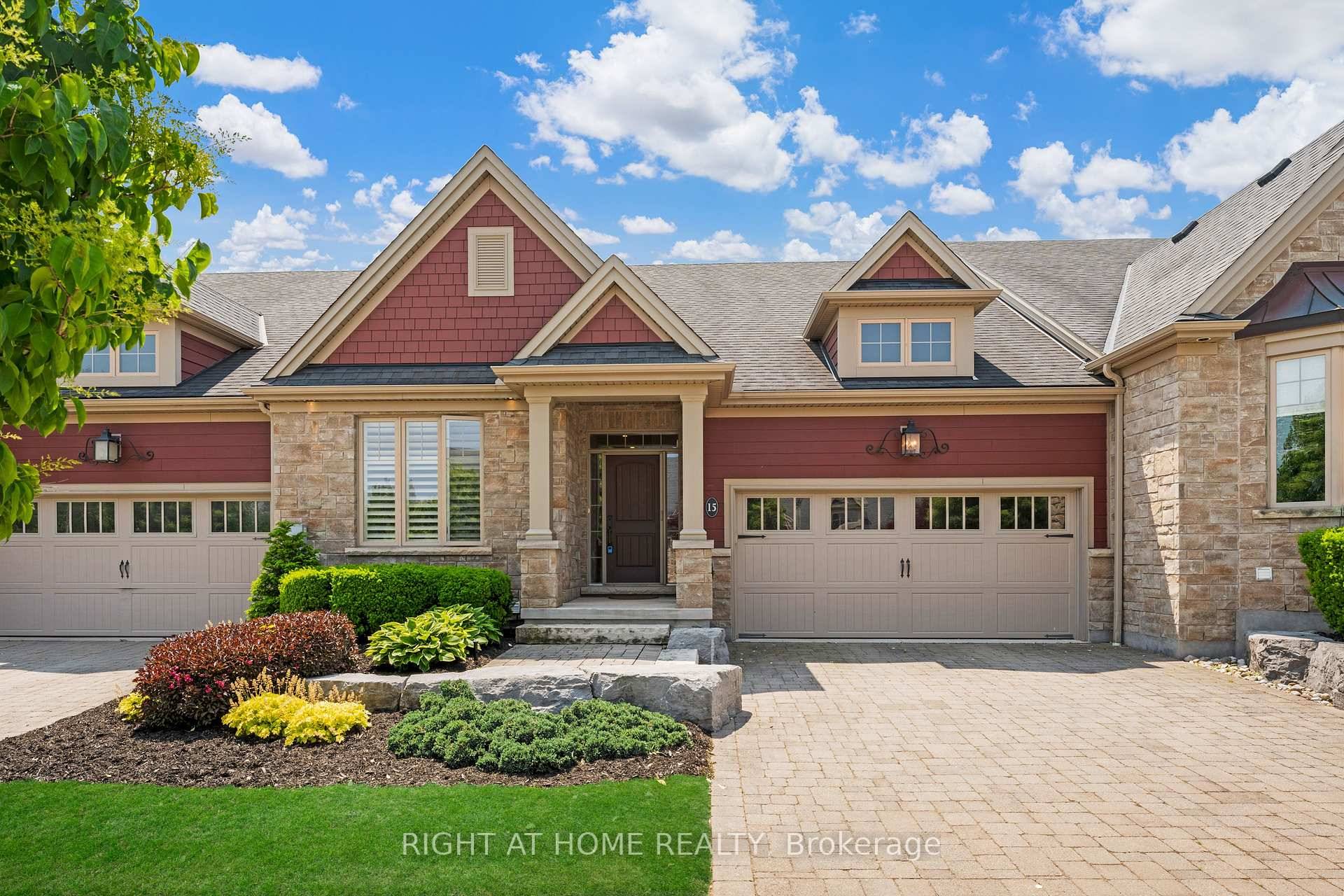 Stunning freehold townhome with double garage on a highly desirable street in St.