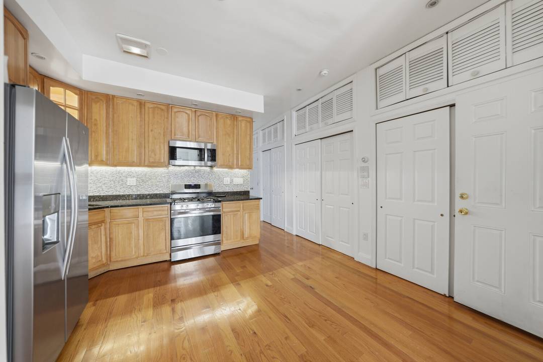Move right into this lovely renovated two family townhouse featuring flexible living space, a finished basement and future expansion potential.