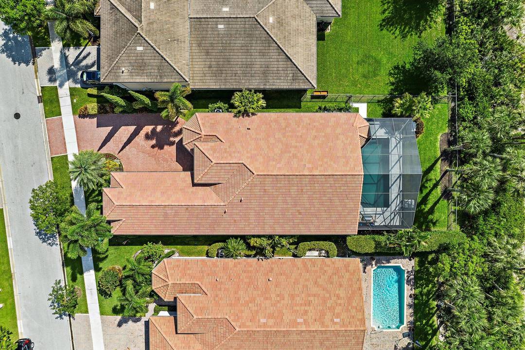 Welcome to 236 Carina Drive, an elegant single story residence in Jupiter Country Club WITH IMMEDIATE GOLF MEMBERSHIP.