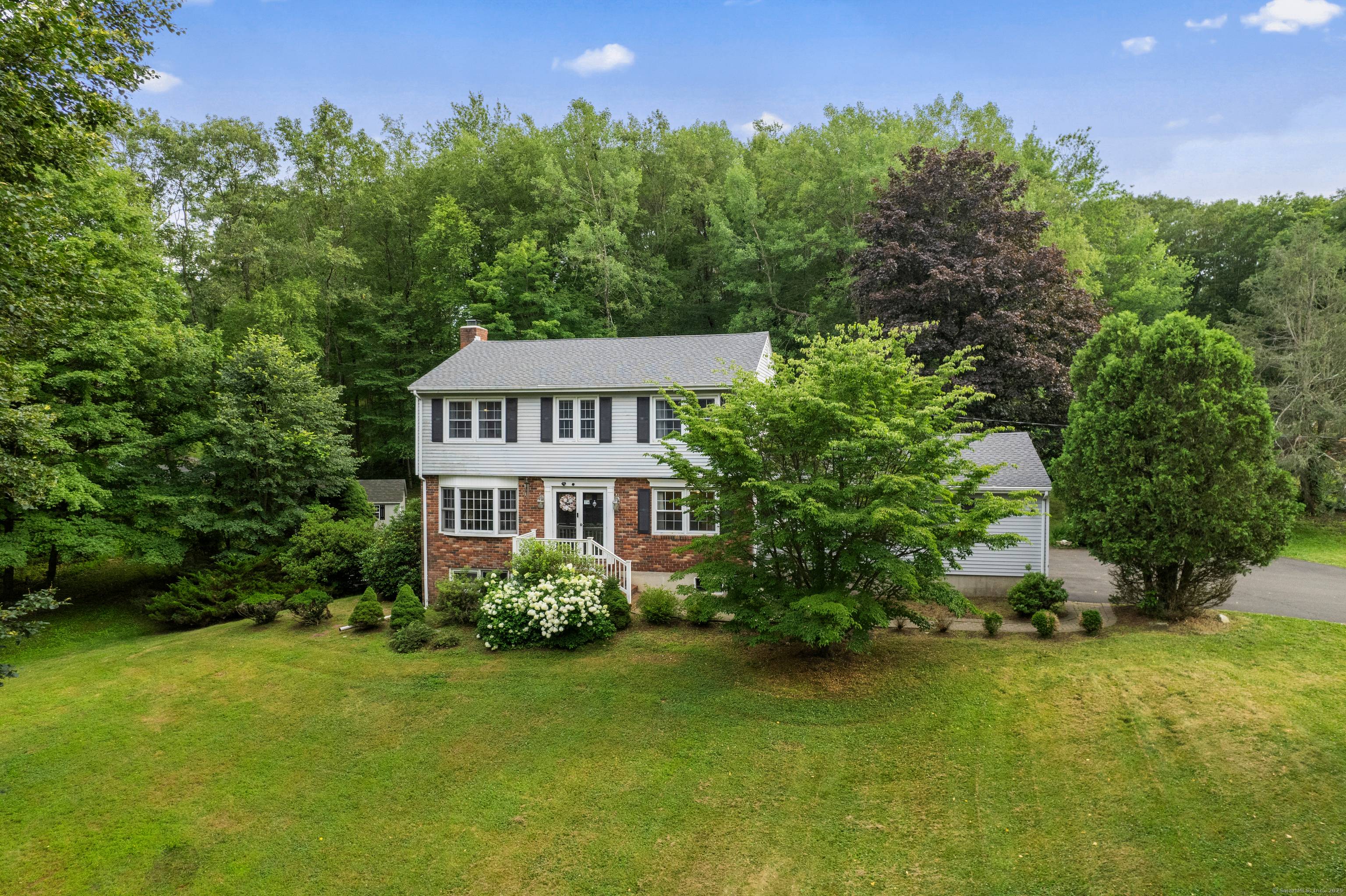Welcome to 2 Judith Drive a stunning 4 bedroom Colonial nestled on a 1 acre corner lot in one of Danbury's most desirable neighborhoods.