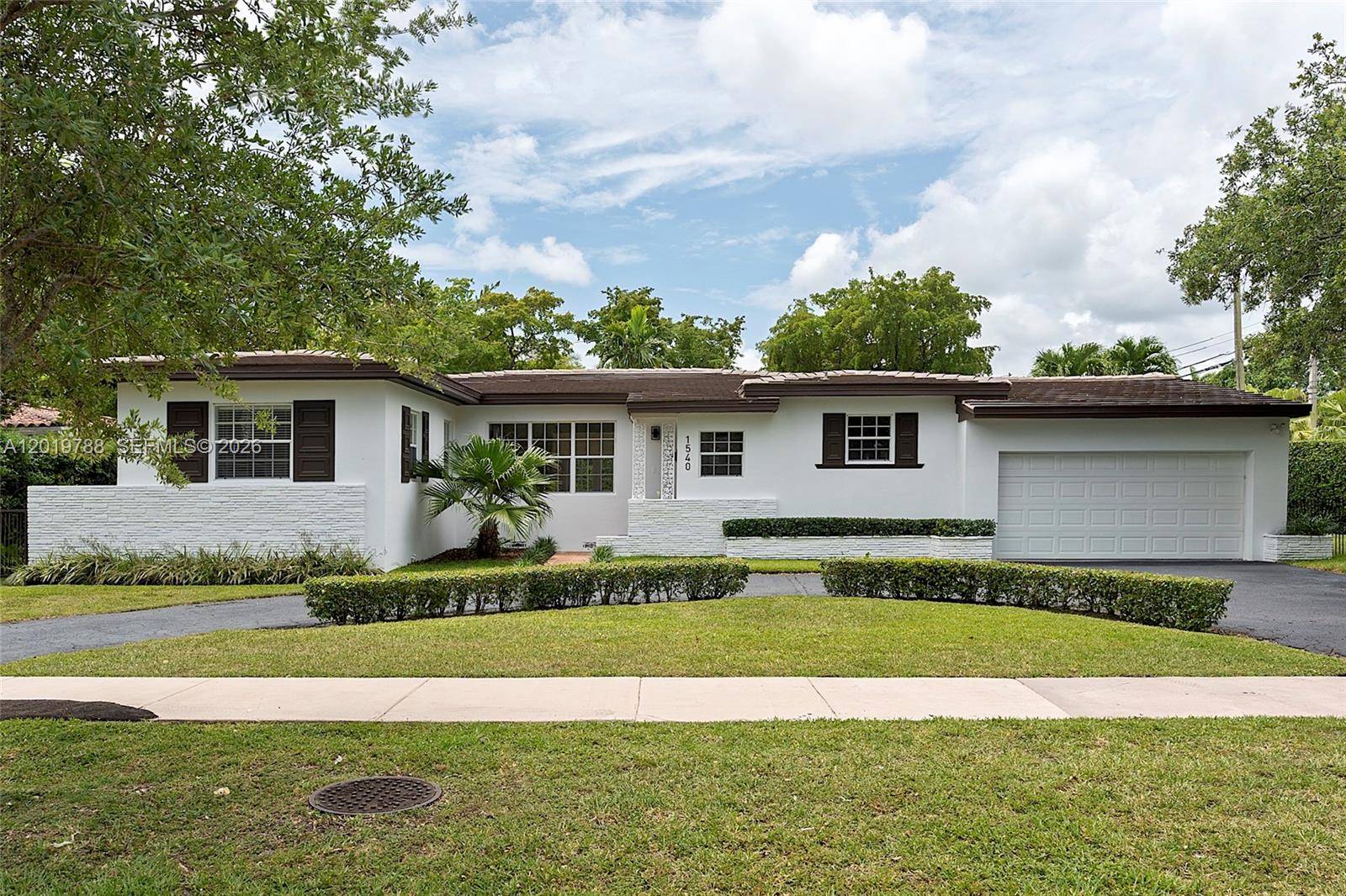 Located on a quiet, tree lined street in the heart of Coral Gables, this timeless residence at 1540 Urbino Ave offers classic elegance, spacious living areas, and an exceptional location.