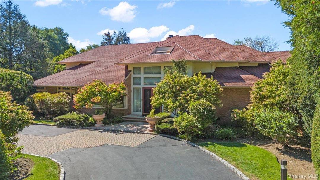 Welcome to 12 Ridge Ct, located in the heart of Old Brookville in the Brookville Meadows.