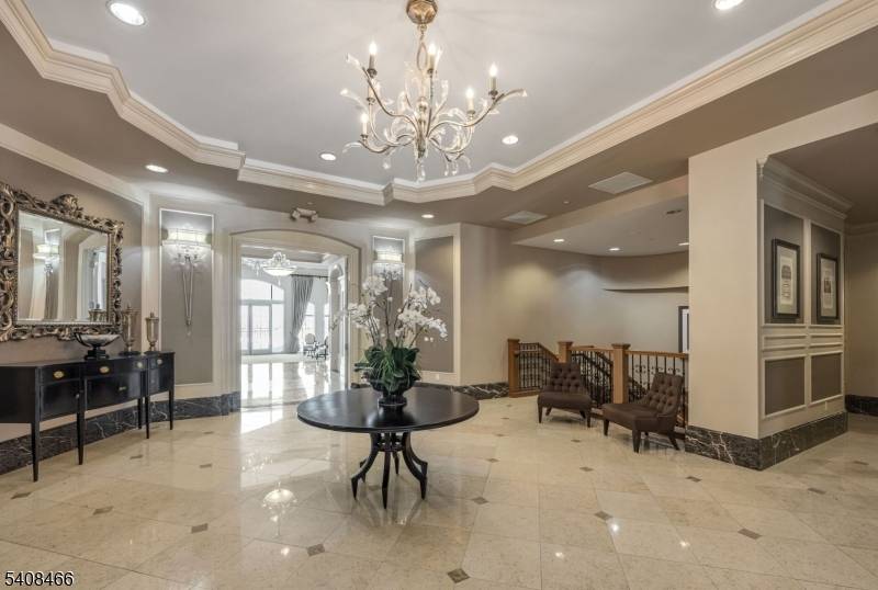 Experience the pinnacle of sophisticated living in this stunning first floor residence located within the prestigious, gated Vizcaya community.