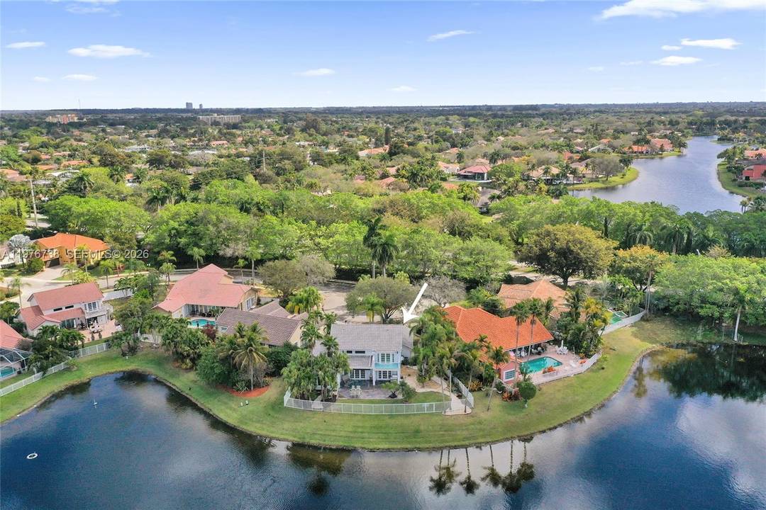 Tucked away on a private cul de sac, this exceptional point lot offers 135 feet of unobstructed panoramic lakefront, your own slice of paradise with breathtaking sunsets.