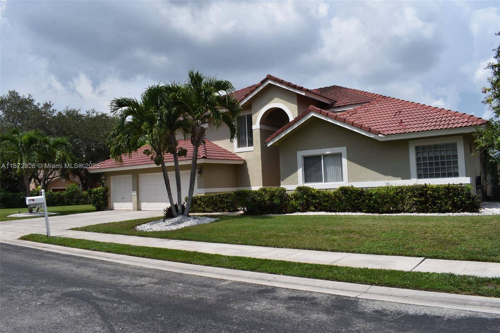 Lakefront with screened Pool on oversized, fruit laden, corner lot over 1 4 acre !