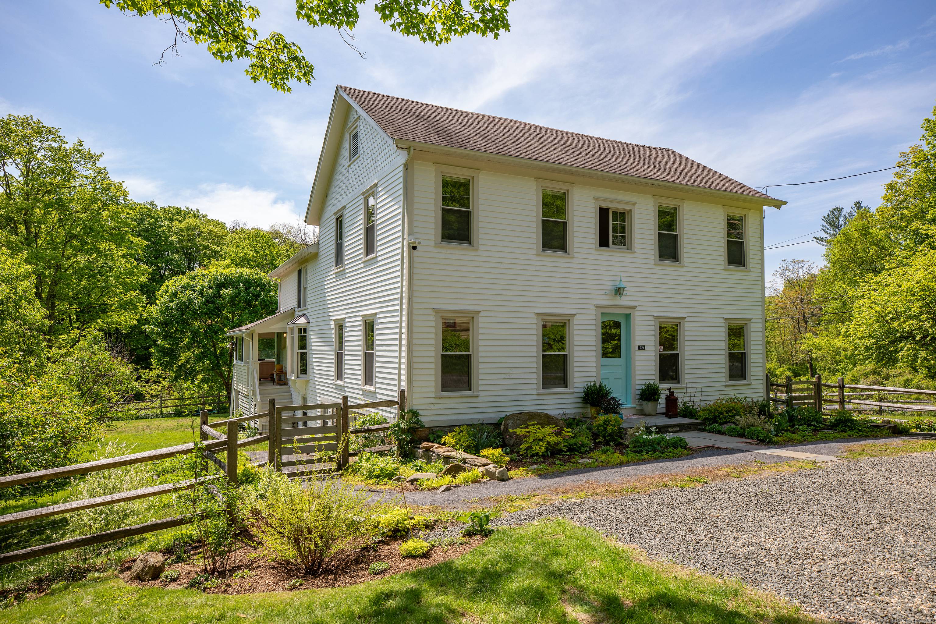 This captivating antique property, located in South Kent, is a treasure trove of history, set against the backdrop of Kent's rolling hills.