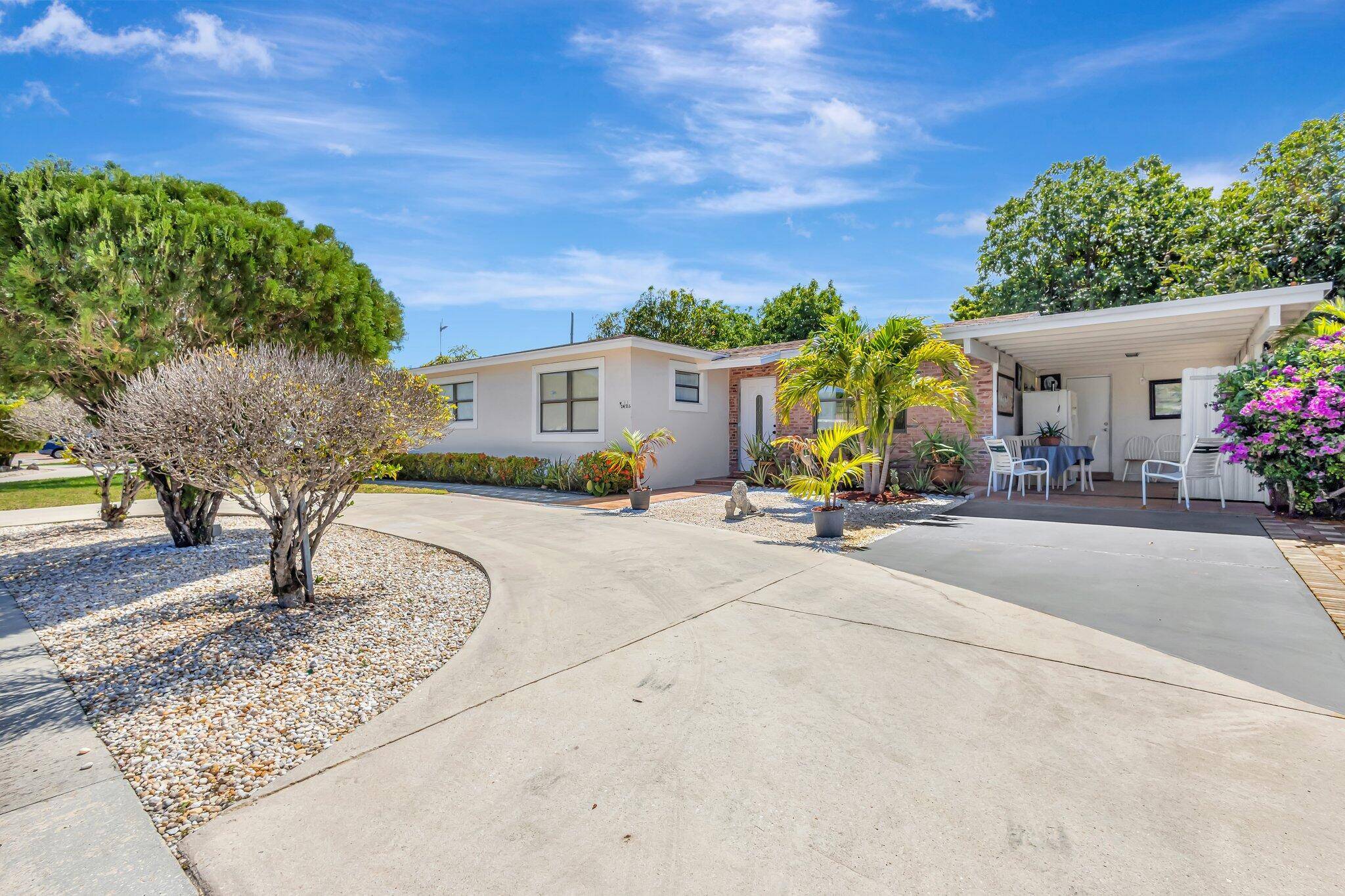 Lovely 3 bed 2 bath single family home with carport and attached mother in law suite with private bath, closet, and separate entrance.