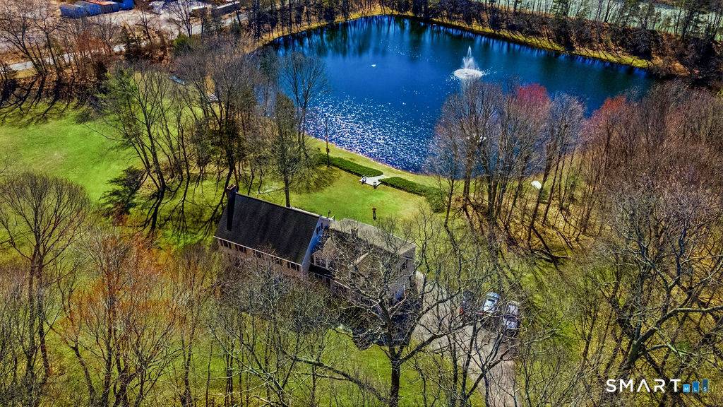Can you imagine 8 acres of privacy surrounding your own pristine 3 acre lake, stocked with bass, just steps from your 4 bedroom home and minutes from Long Island Sound ...