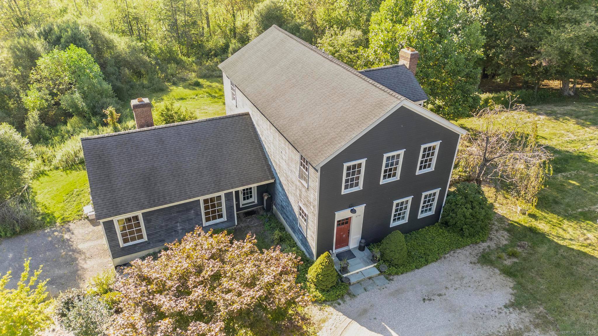 Step into this classic farmhouse charm with the clean lines and thoughtful proportions of this architect designed colonial, built in 2004 and on approximately 2.