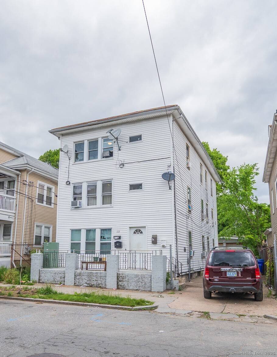 This spacious 3 Family Home offers an excellent investment opportunity, featuring three units each with three bedrooms, a double living room, a kitchen, and beautiful hardwood floors.