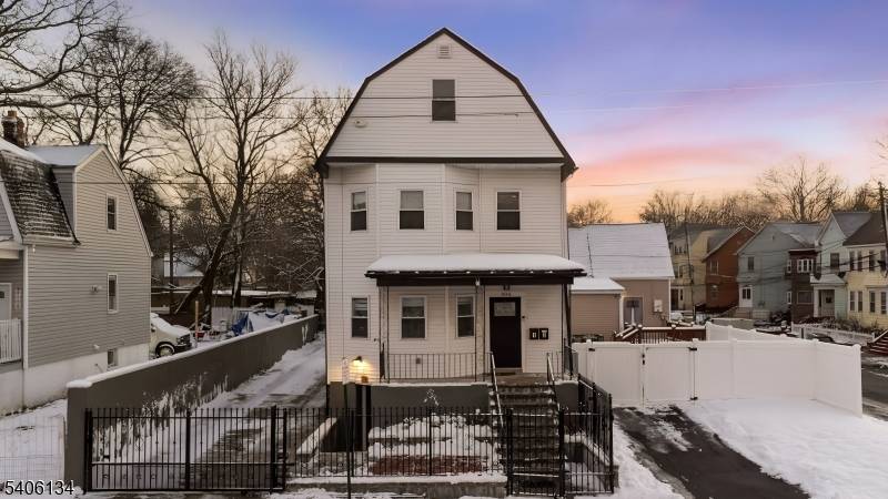 Discover this beautifully reimagined two family Dutch Colonial in Irvington, New Jersey, completely rebuilt with quality and attention to detail.