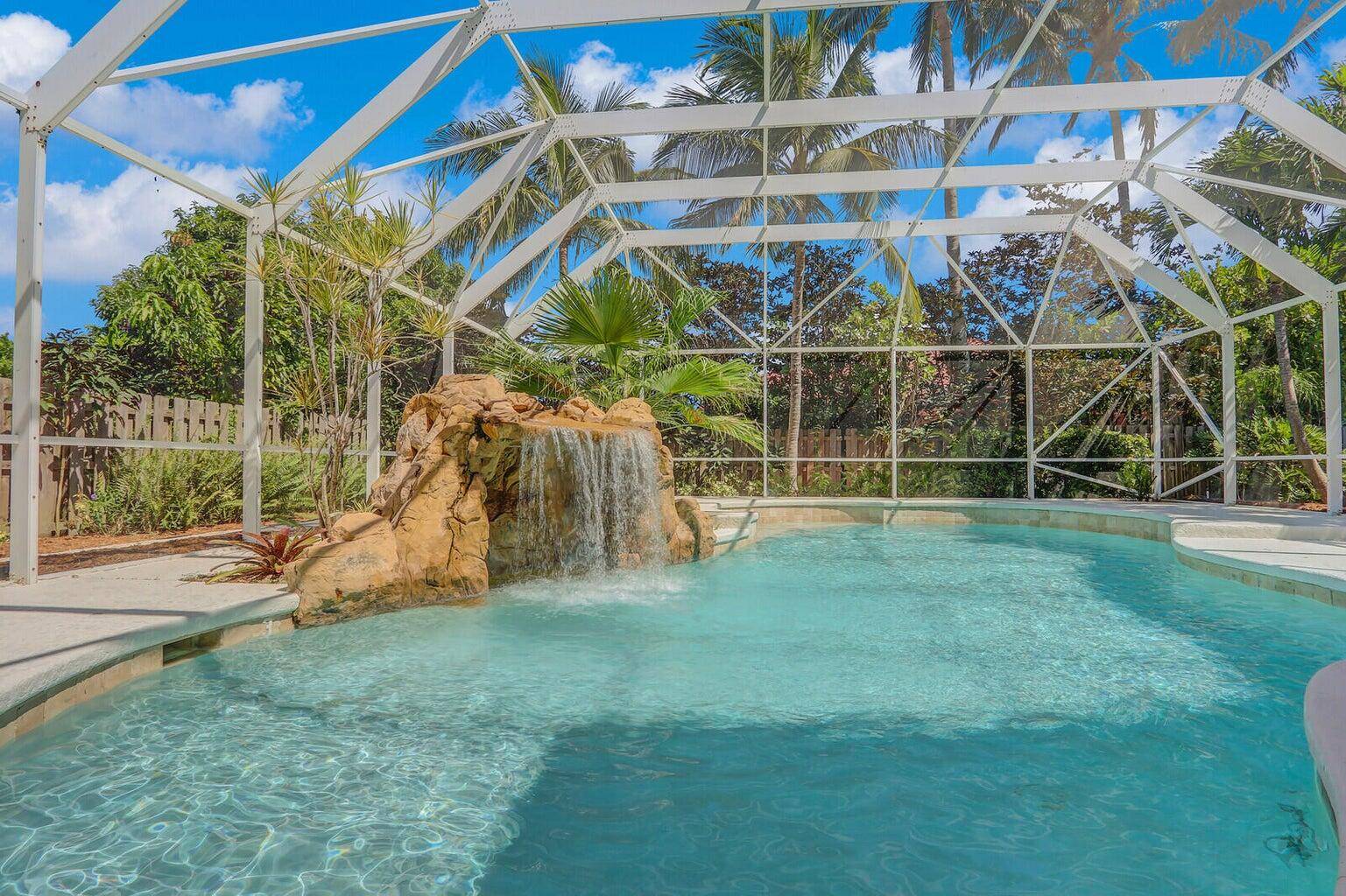 Beautiful, private waterfall grotto pool home is ready to be your oasis.