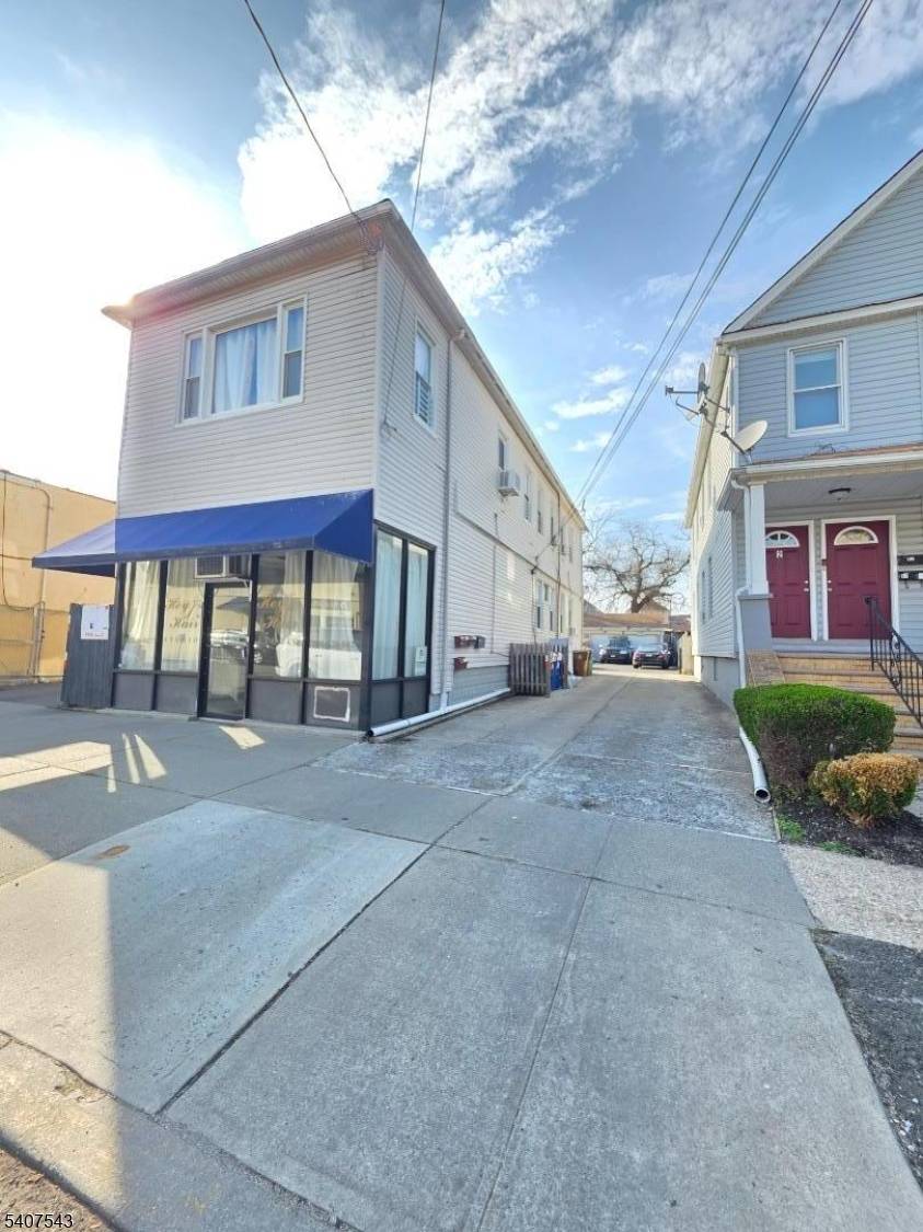 Must see this well located mixed use investment property in the heart of Linden !
