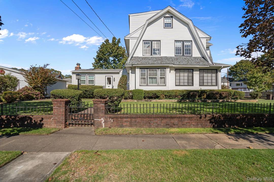 Located in the heart of Lynbrook, this Classic Tudor Style home has retained its Beauty and Charm with Rich Chestnut Paneling and Beautiful Trim throughout various parts of the home.