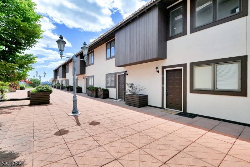 Welcome to this stunning Mediterranean style townhouse located in a gated community w 24 7 security.