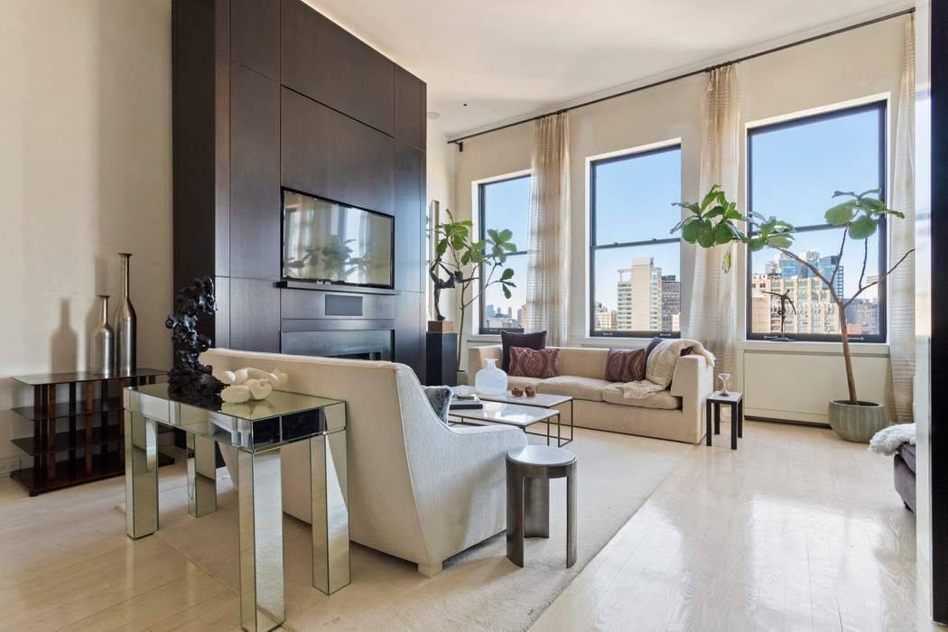 Quintessential 4 bedroom, 3 bath Soho duplex penthouse with three private terraces and a keyed elevator that opens directly into light filled loft living and dining areas.