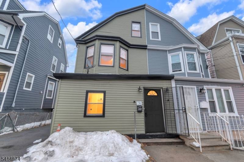 Welcome to this beautifully renovated single family half duplex style home that perfectly blends modern upgrades with timeless appeal.