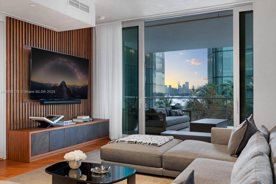 Step Inside With Me ! A statement in contemporary design, this designer flow through corner residence showcases water views and an ideal floorplan.