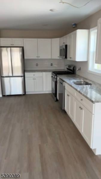 This Stunning 2 Family Home offers Modern living each unit features 3 bedrooms, 2 full bathrooms, dedicated Laundry Rooms and ample Storage Space enjoy Recessed, Lighting throughout, Granite, Kitchen Countertop, ...