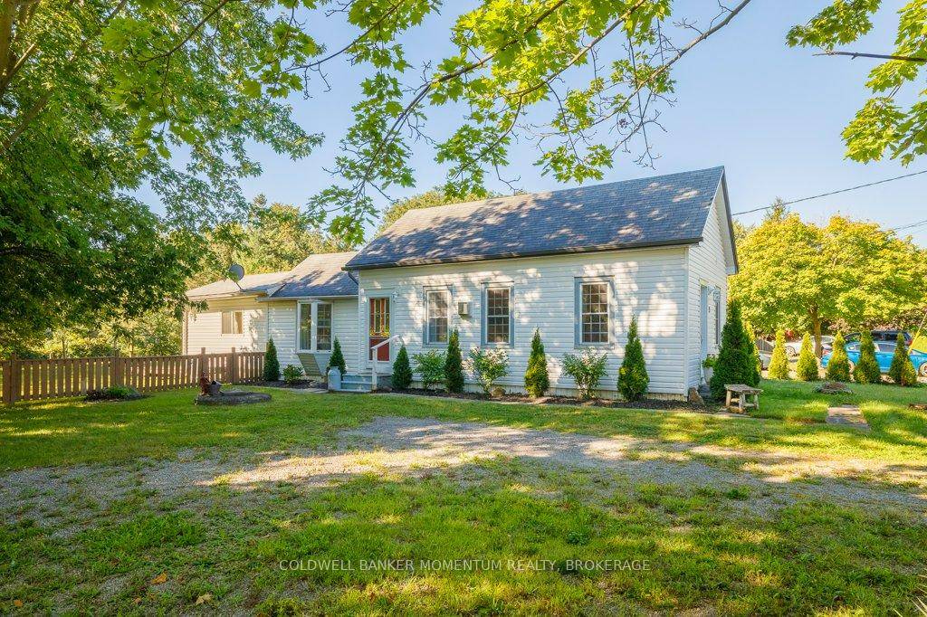 Immaculate bungalow set on lovely, spacious lot with private backyard oasis.