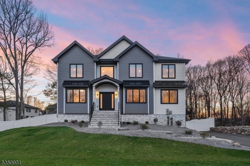 Stunning, NEW construction Colonial blending timeless elegance with modern design on a tree lined property.