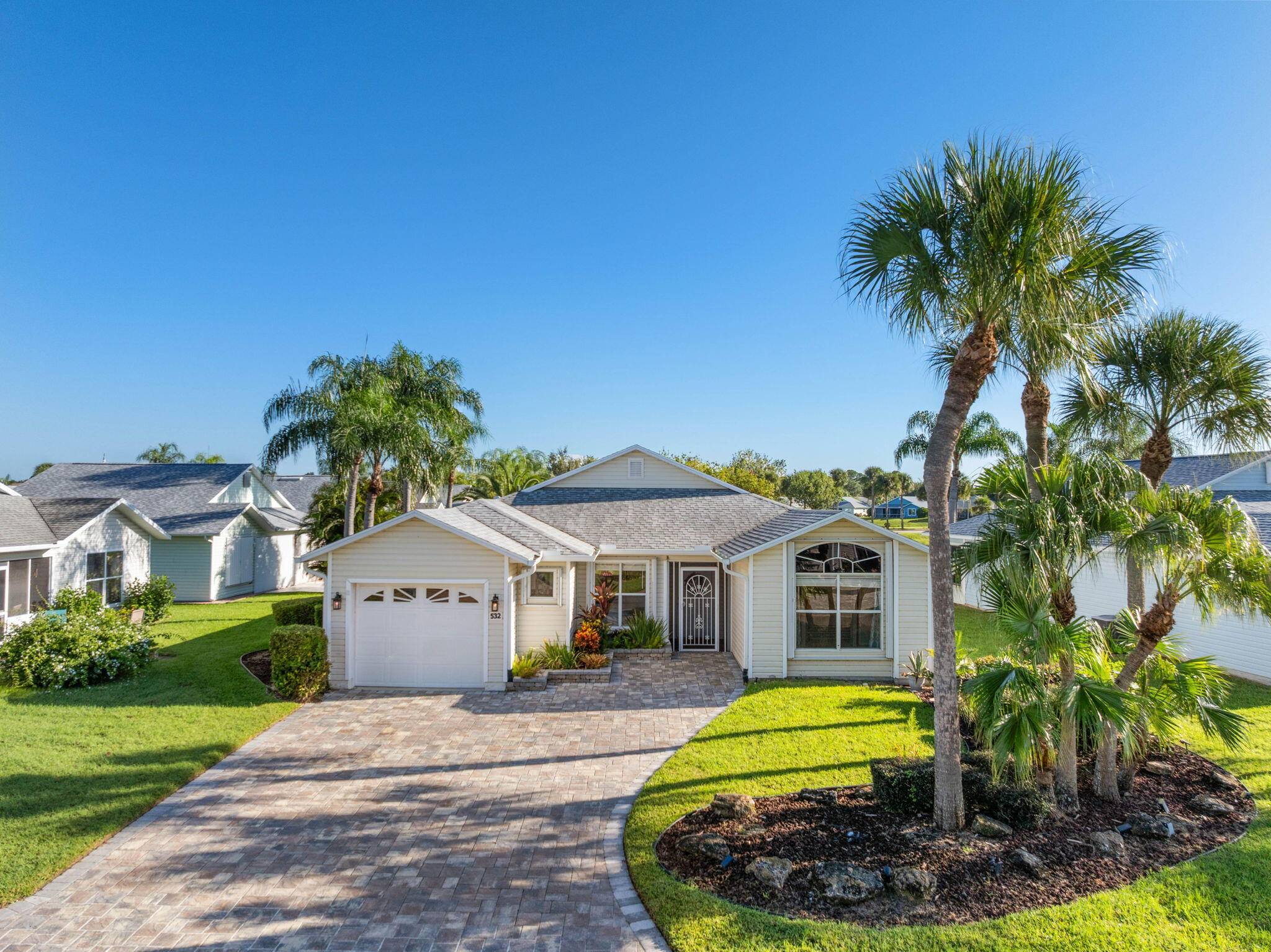 Waterfront Living ! Bright and beautiful 2 bedroom, 2 bathroom villa in the Palm Grove 55 Community.