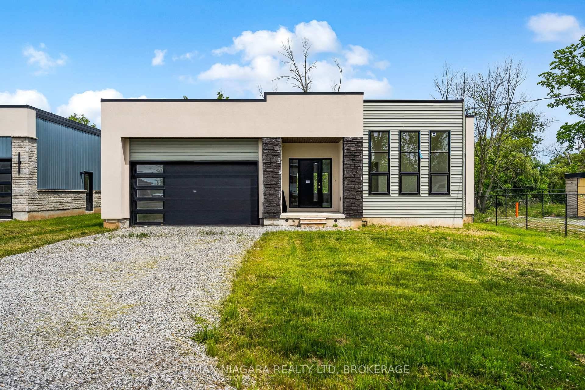 Be the first to live in this never lived in 3 bedroom, 2 bathroom bungalow featuring tall ceilings, a cozy fireplace, and a spacious kitchen with pantry.