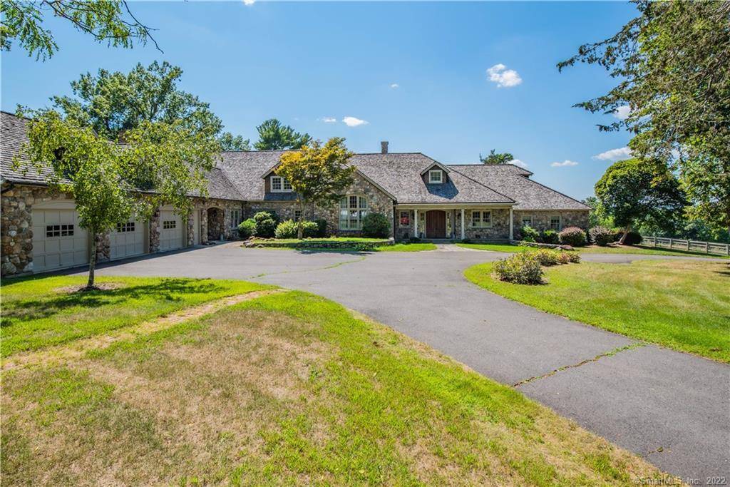 Welcome to this extraordinary stone and shingle country estate, nestled on 70 acres of private retreat.