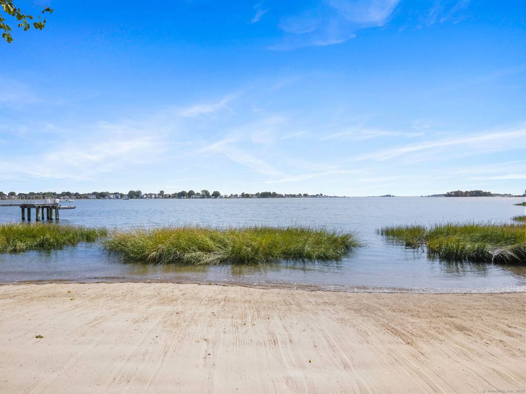 Charming, Curb Appeal Casual Elegance throughout this elevated DIRECT WATERFRONT property !