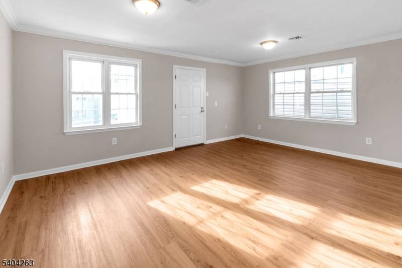 139 Inslee Pl presents a well maintained three story two family property located in the Elizabethport section of Elizabeth.