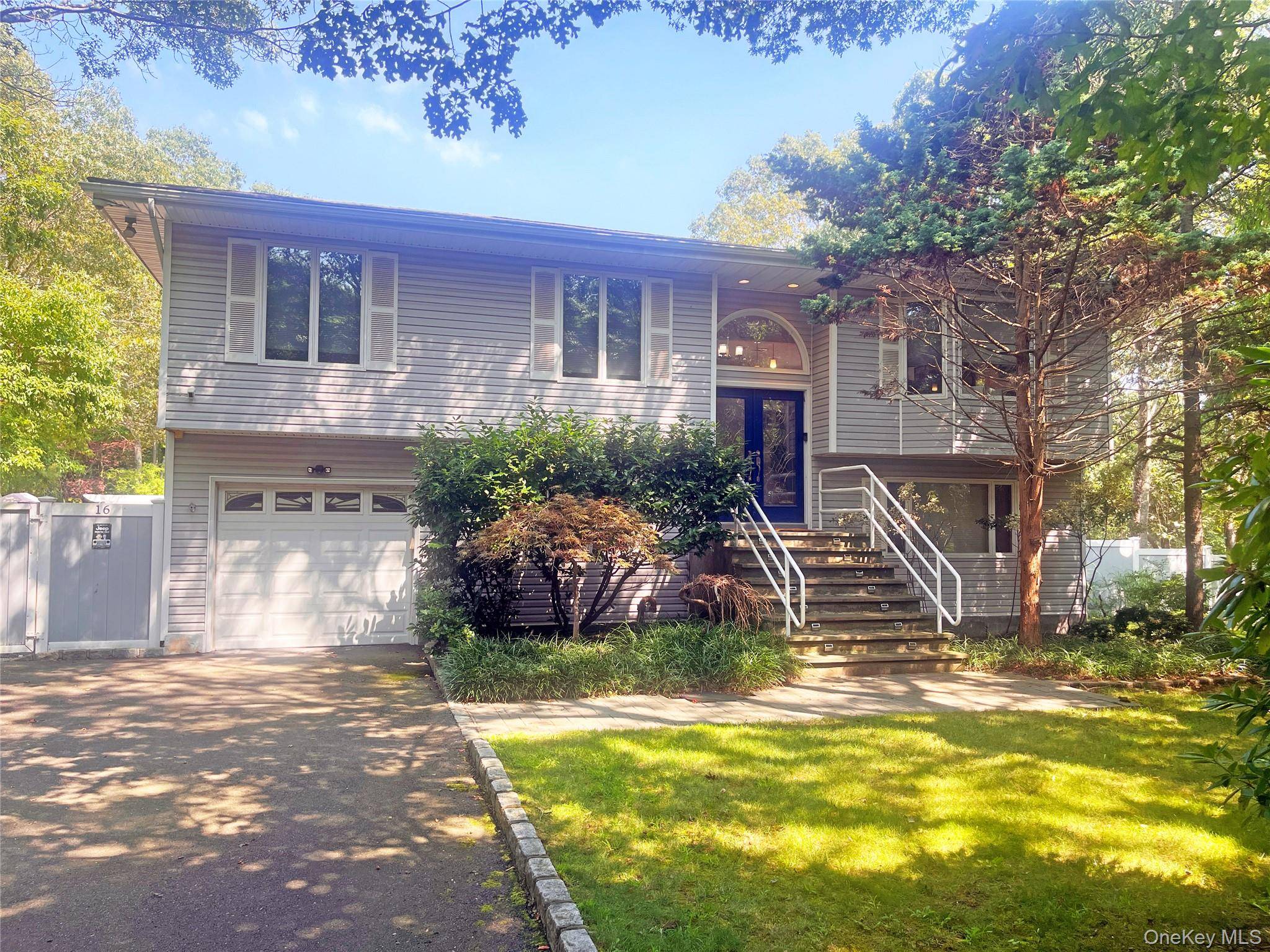 Welcome to 16 Stuart Court, located in the Squire Woods Community in Hampton Bays.