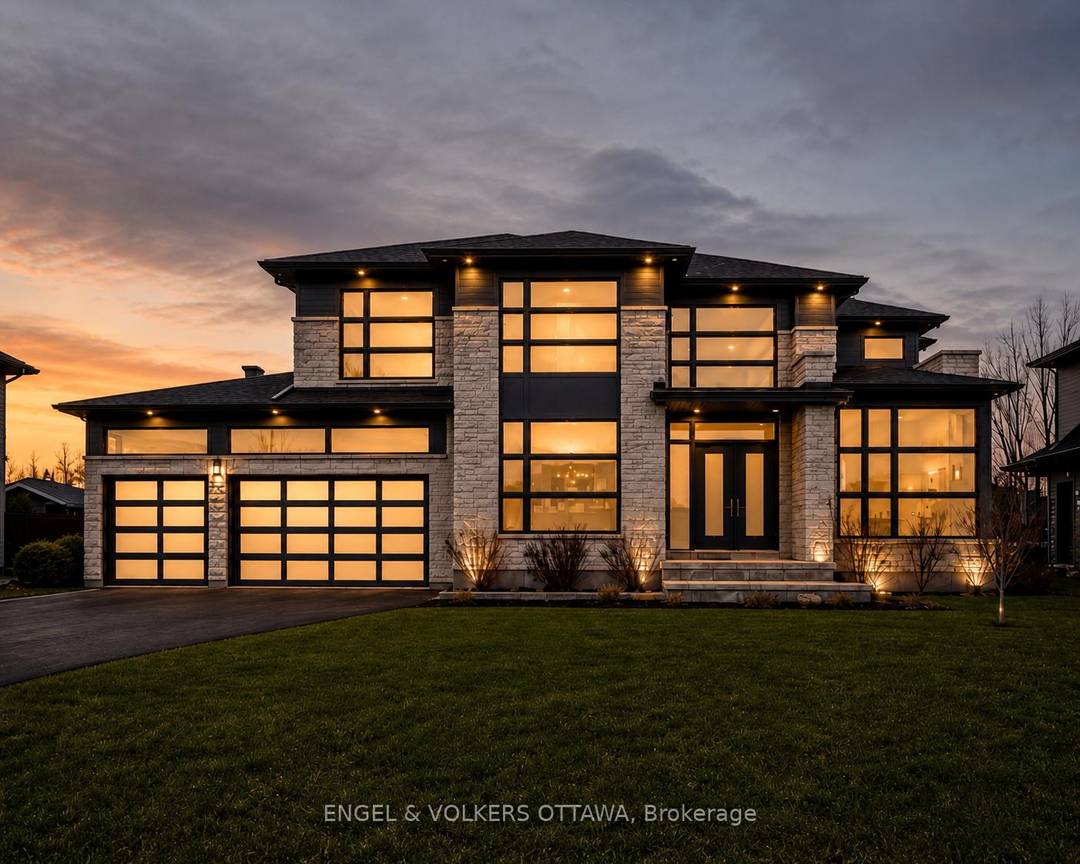 Set within the prestigious Manotick Estates, this exceptional 6 bedroom, 6 bathroom custom home by Triform Construction showcases a seamless blend of versatility and modern luxury.