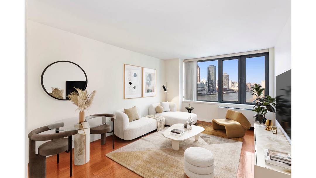 Welcome home to this large, sun filled, high floor 1BR 1BA apartment with sparkling water views of the Manhattan skyline through oversized floor to ceiling windows.