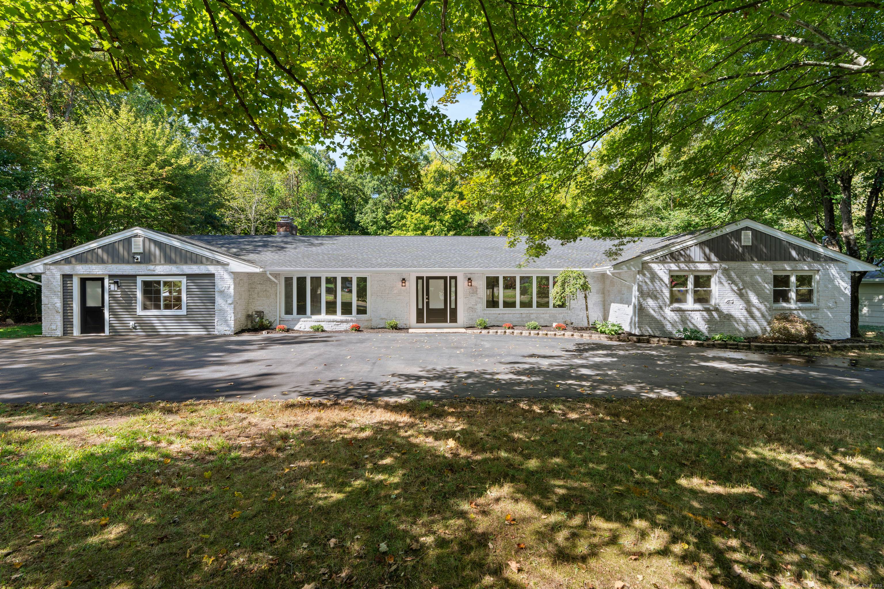 Welcome to 21 Featherbed Lane a beautifully renovated 5 BR, 4 bath ranch south of route 1 in Branford.