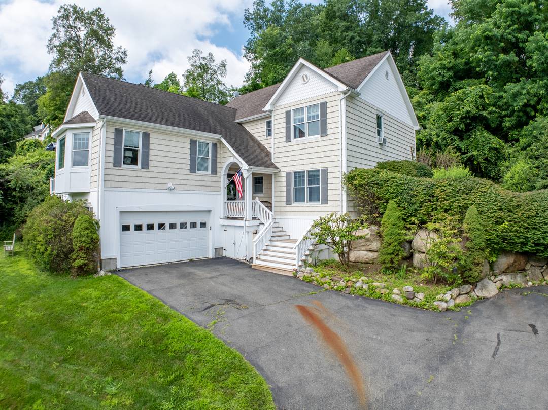 Located in lower litchfield county, through rolling hills, horse farms and pastures, and set a short stroll away from a sandy beach and boat dock on Candlewood lake, this updated ...