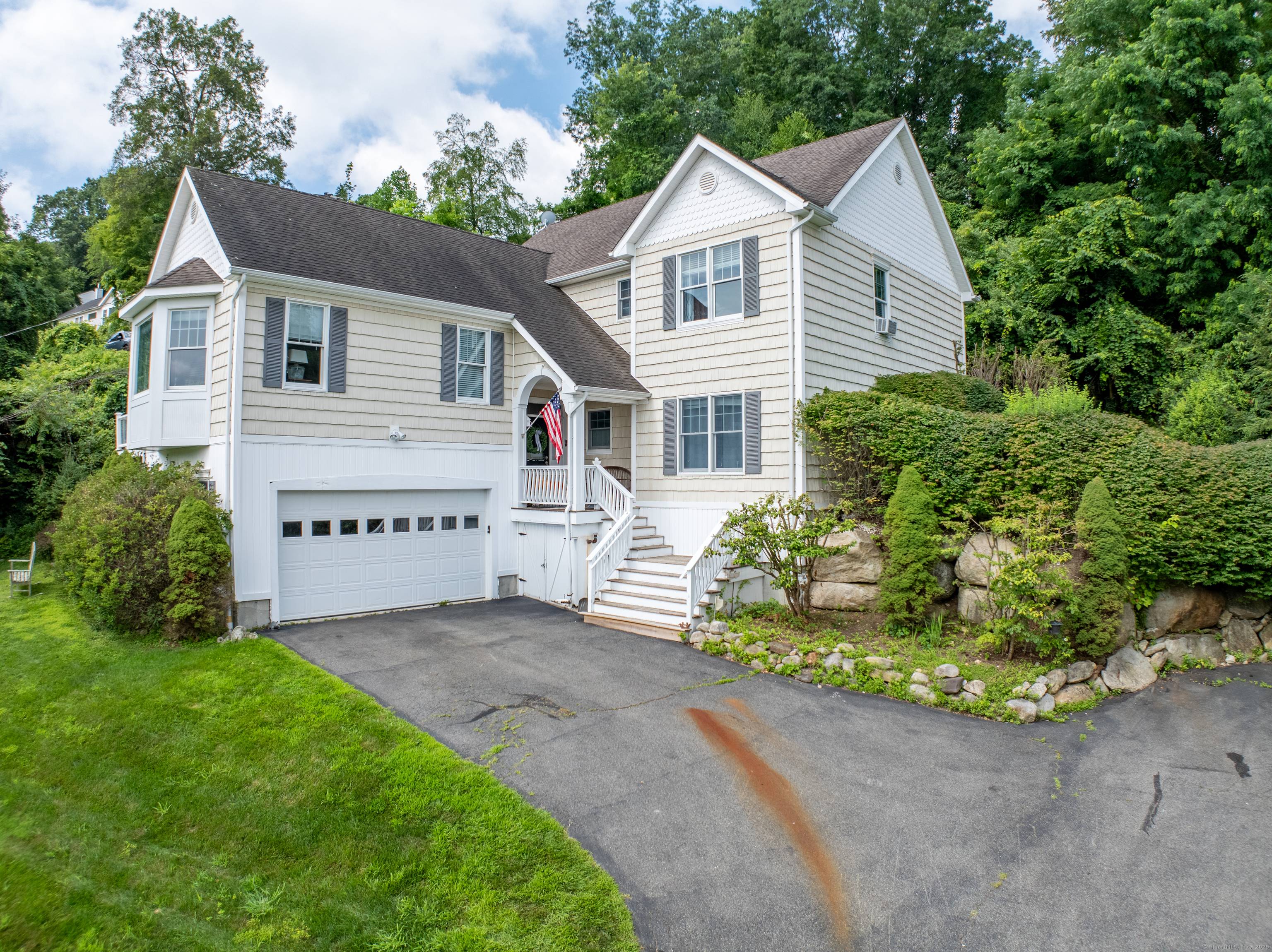 Located in lower litchfield county, through rolling hills, horse farms and pastures, and set a short stroll away from a sandy beach and boat dock on Candlewood lake, this updated ...