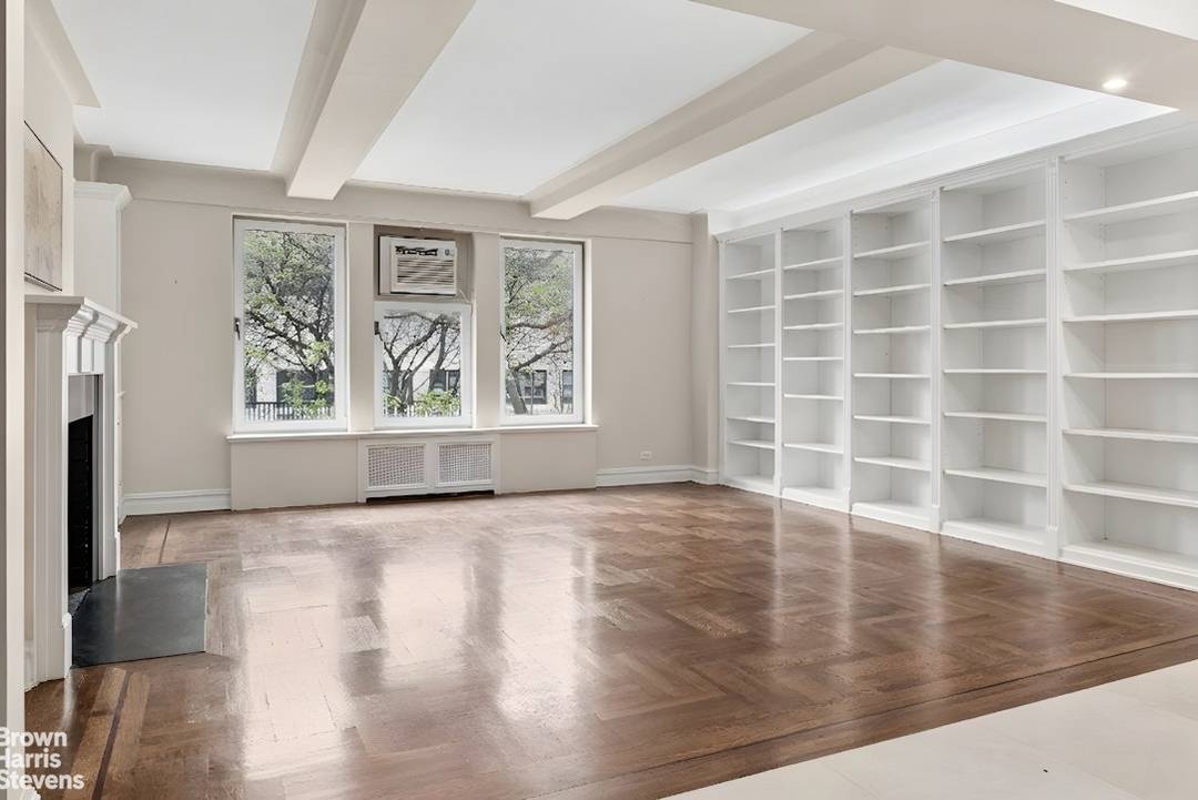 Prewar 3 Bedroom, 3 Bathroom Condo with Wood Burning Fireplace This beautifully renovated residence blends the warmth and charm of classic prewar design with a modern, loft like downtown aesthetic.