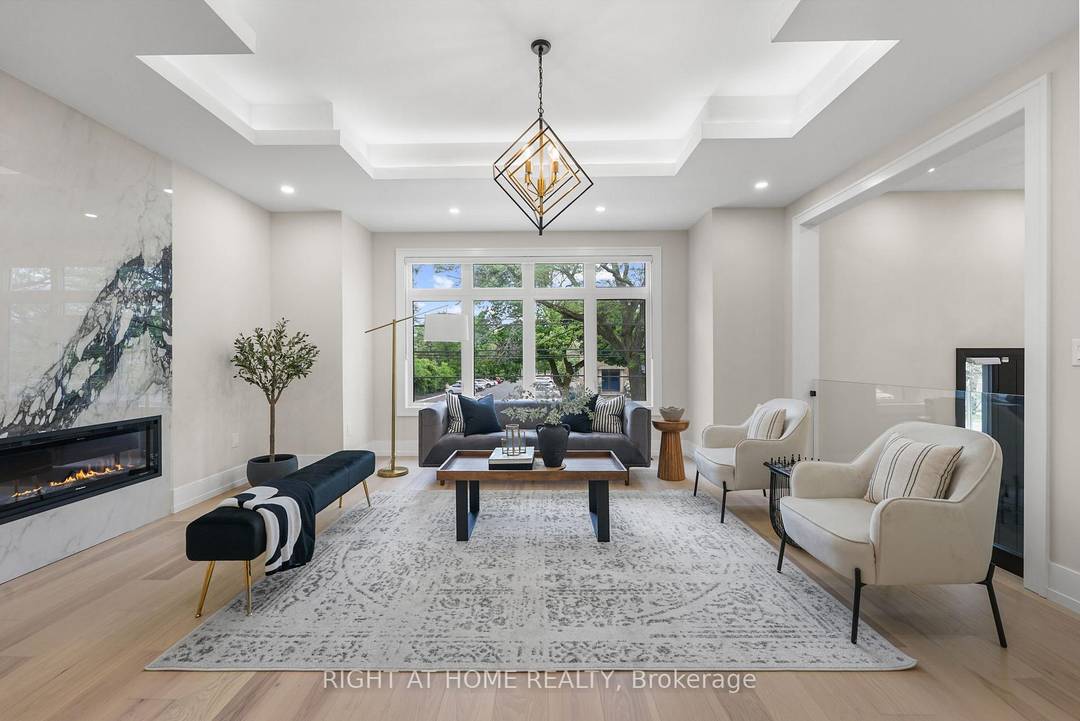 Client Remarks Experience luxury in this modern Willowdale West residence, showcasing a chefs kitchen with a waterfall island, custom cabinetry, and high end appliances.