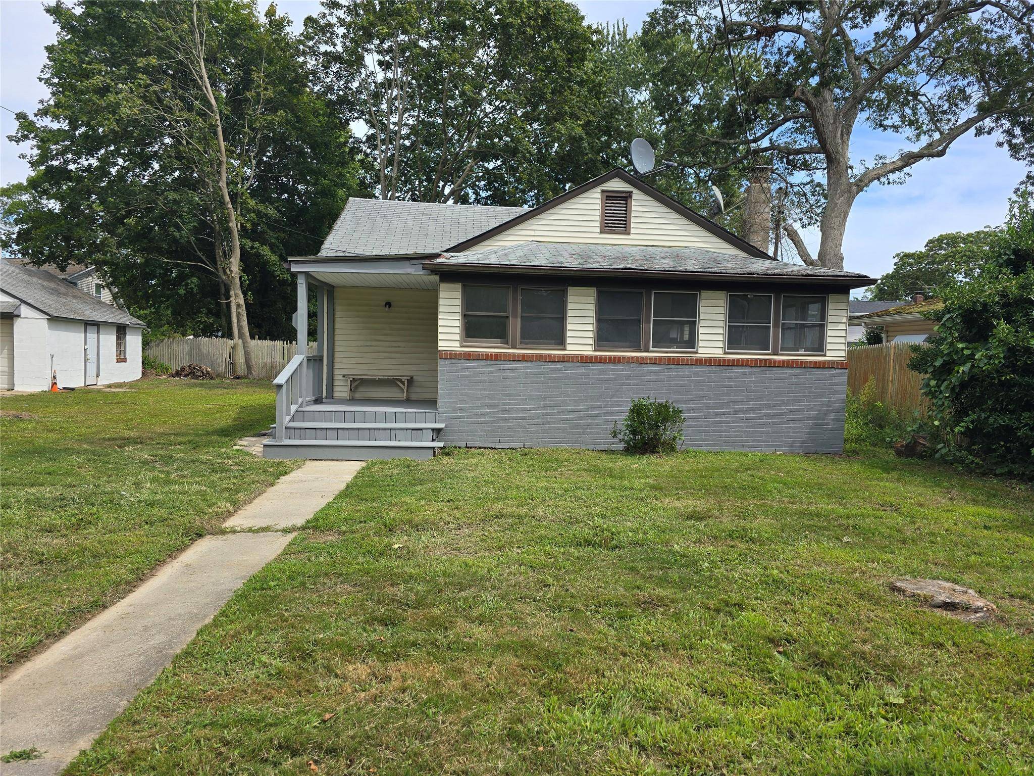 3 Bedroom ranch with basement, covered porch and detached 2 car garage on 1 2 acre lot.