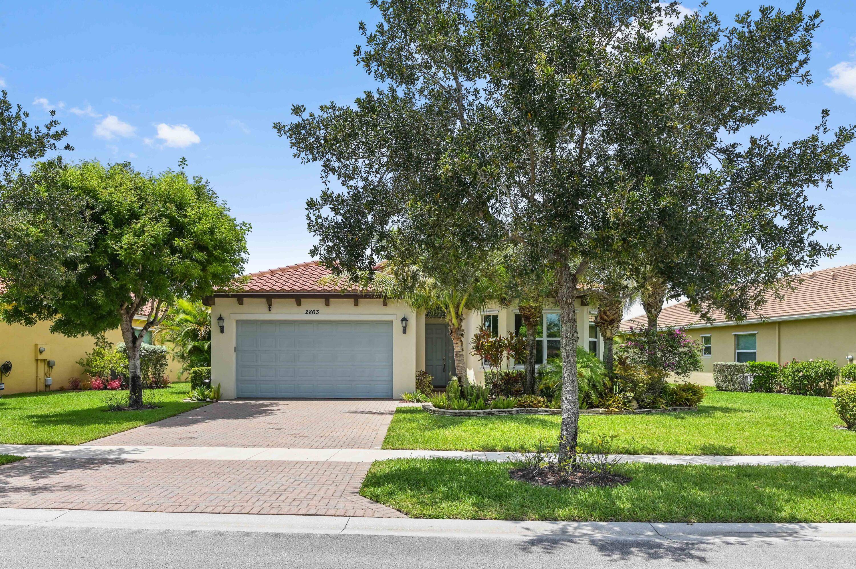 Stunning lakefront gem with a privately fenced yard and oversized screened lanai with picture perfect water views, boasting 4 beds and 2.
