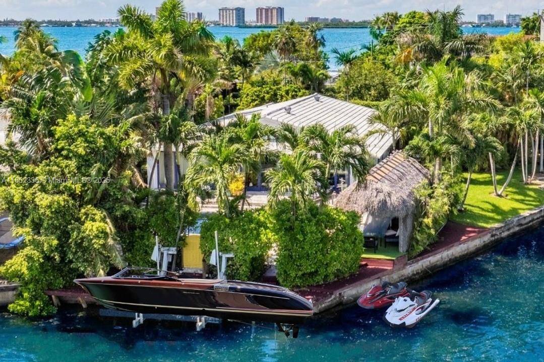 Rare opportunity to own corner, gated waterfront property on Miami Beach s exclusive Biscayne Point.