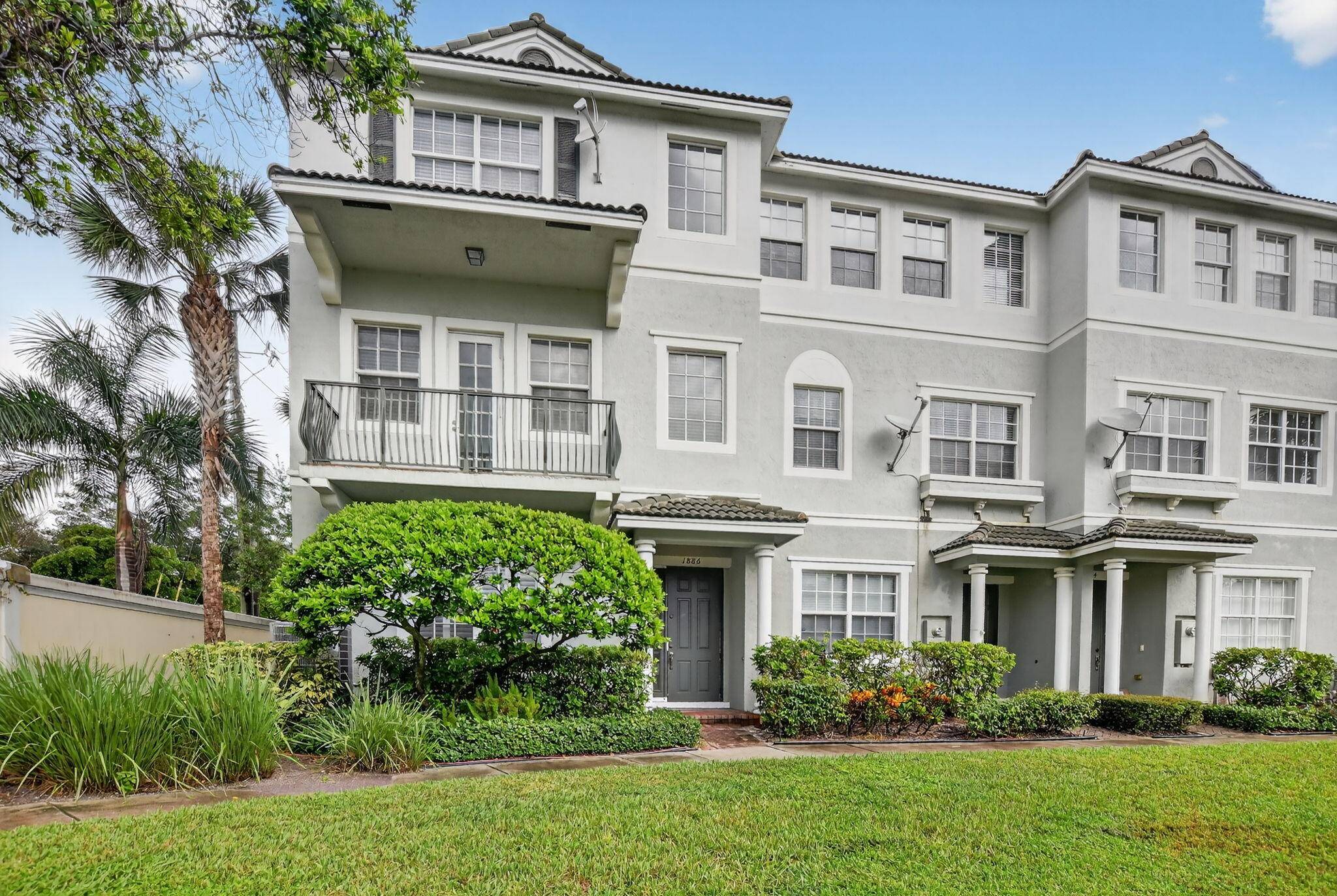 Beautiful Corner Townhome with Extra ParkingLight, bright, and airy, this charming corner townhome features impact windows and fresh paint throughout.
