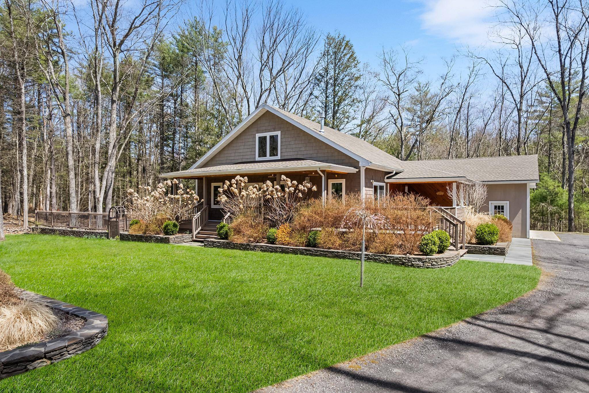 Welcome to 220 John Joy Road, a meticulously maintained and thoughtfully upgraded home tucked away in the heart of Woodstock, NY.
