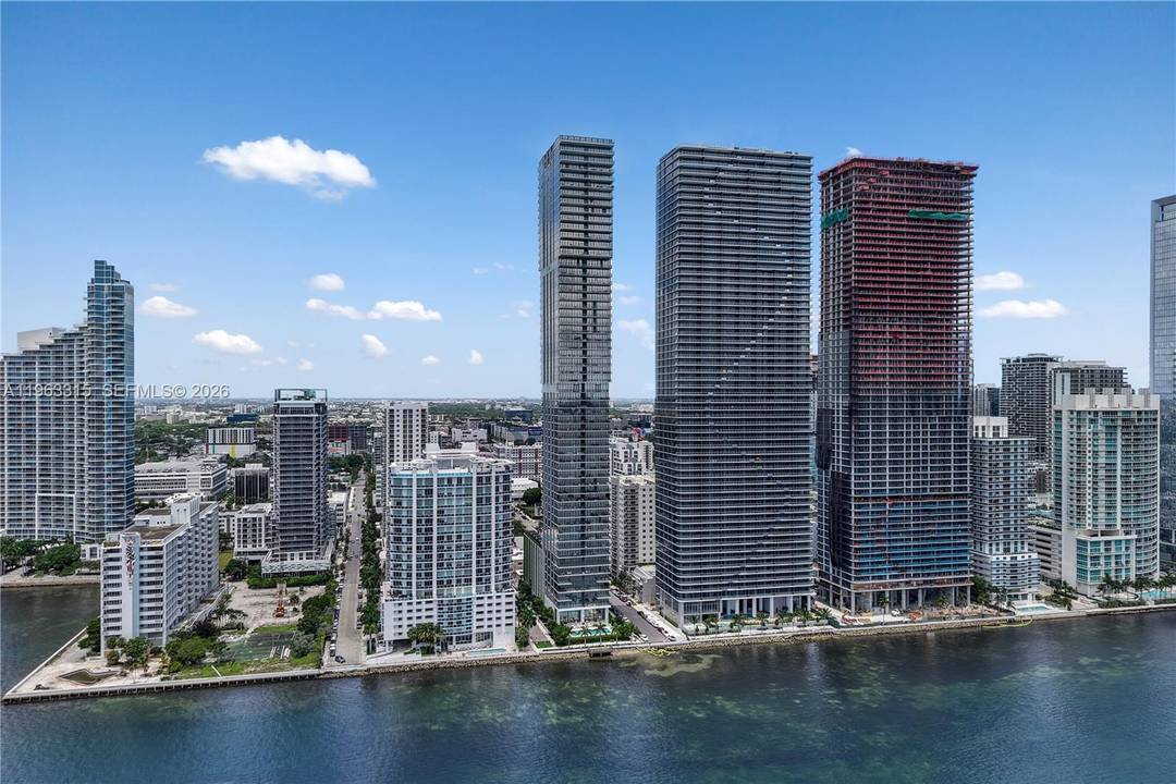 Spectacular 180 views of Downtown Miami, open bay, and ocean from this turnkey residence at Elysee Miami.