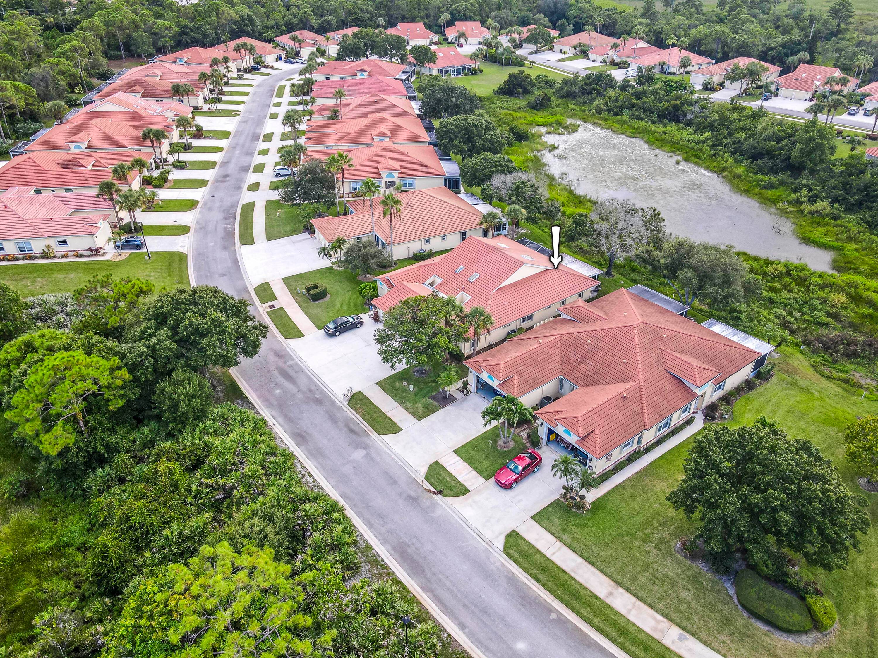 Well maintained lakefront villa in the highly sought after 55 adult community of Whispering Sound in Palm City.
